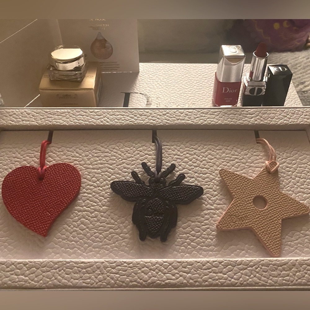 Dior bag charms and beauty products